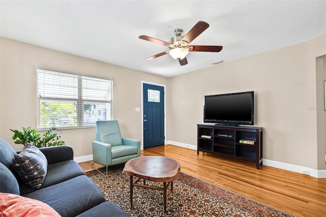 3300 Jackson St N, Saint Petersburg, FL 33704 - living area with visible vents, ceiling fan, wood finished floors, and baseboards
