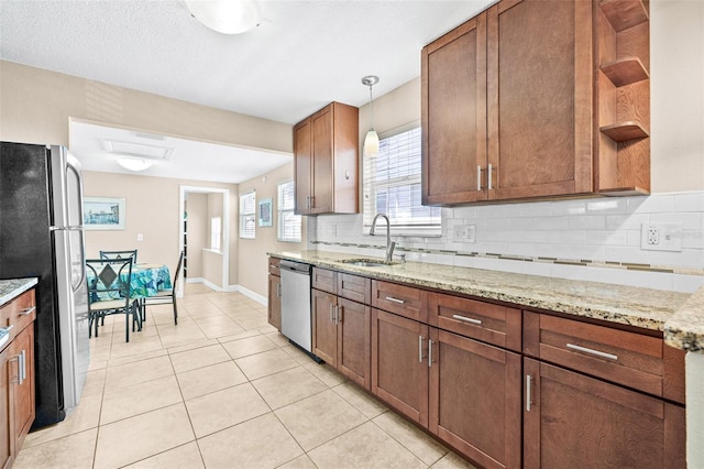 3300 Jackson St N, Saint Petersburg, FL 33704 - kitchen featuring appliances with stainless steel finishes, backsplash, open shelves, and a sink