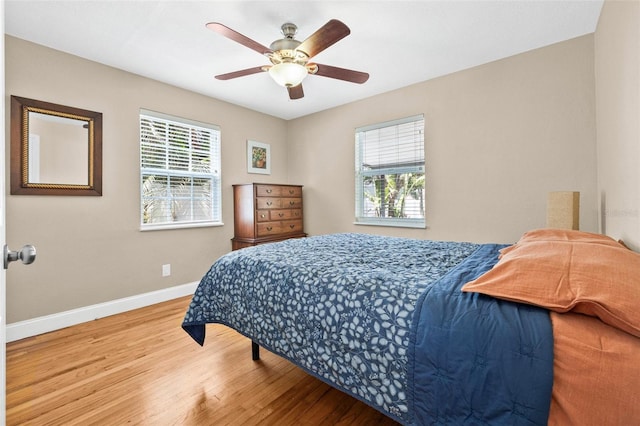 3300 Jackson St N, Saint Petersburg, FL 33704 - bedroom featuring a ceiling fan, wood finished floors, and baseboards