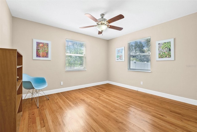3300 Jackson St N, Saint Petersburg, FL 33704 - interior space with a ceiling fan, wood finished floors, and baseboards