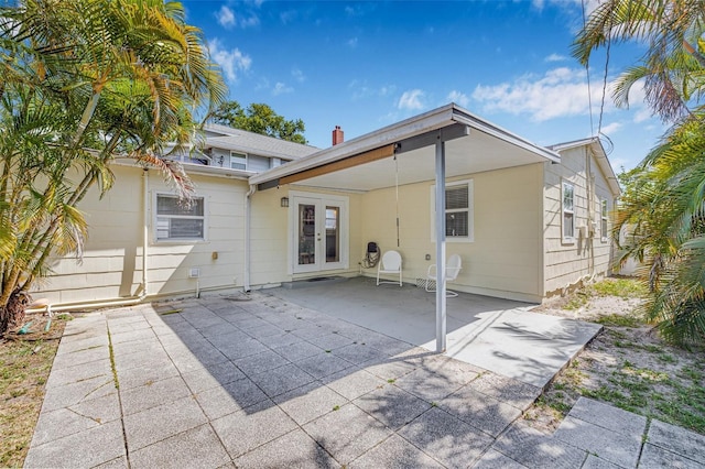 3300 Jackson St N, Saint Petersburg, FL 33704 - rear view of property with a patio and french doors