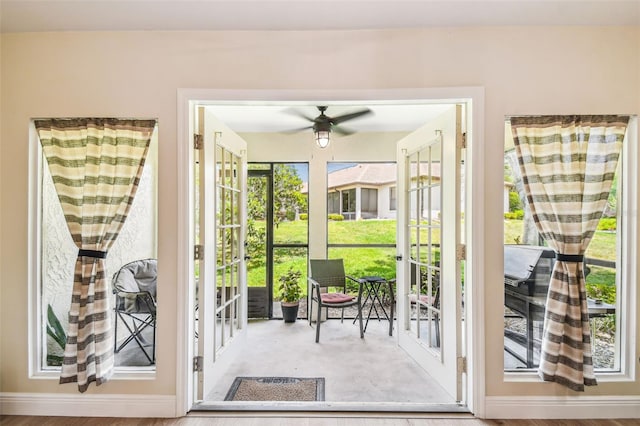 entryway with ceiling fan and a wealth of natural light