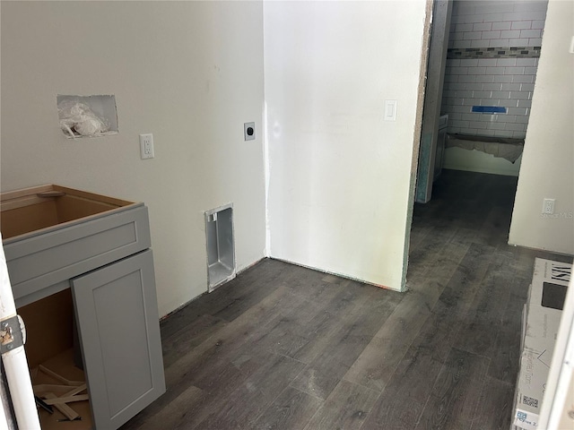 laundry room with hookup for an electric dryer and dark wood-style flooring