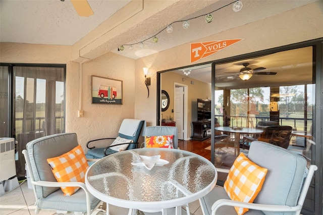 1817 Golfview Dr Unit 1817, Tarpon Springs, FL 34689 - tiled dining area with a ceiling fan and a textured wall