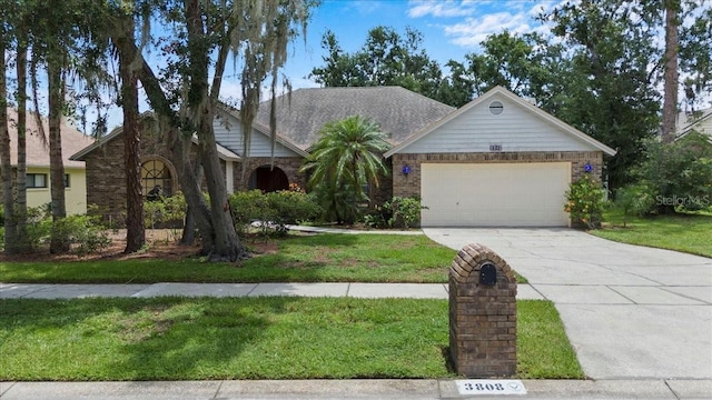 3808 Hollow Wood Dr, Valrico, FL 33594 - view of front facade featuring concrete driveway, an attached garage, a front lawn, and brick siding