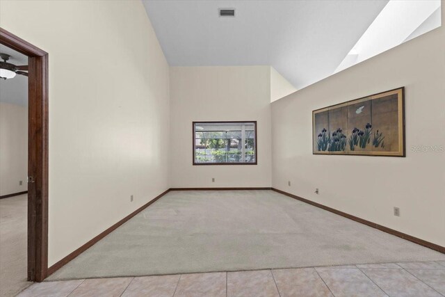 3808 Hollow Wood Dr, Valrico, FL 33594 - unfurnished room with light colored carpet and vaulted ceiling