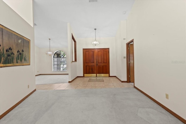 3808 Hollow Wood Dr, Valrico, FL 33594 - tiled entrance foyer with carpet floors and a chandelier