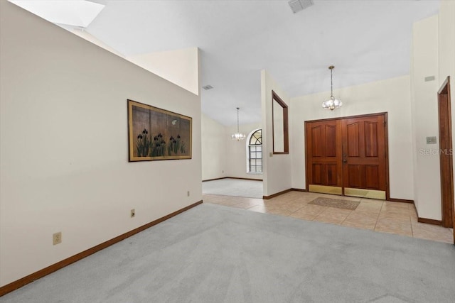 3808 Hollow Wood Dr, Valrico, FL 33594 - tiled entrance foyer featuring a chandelier, carpet floors, a skylight, and lofted ceiling