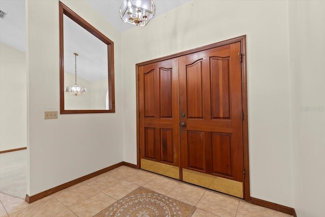 3808 Hollow Wood Dr, Valrico, FL 33594 - entryway with a chandelier and light tile patterned floors