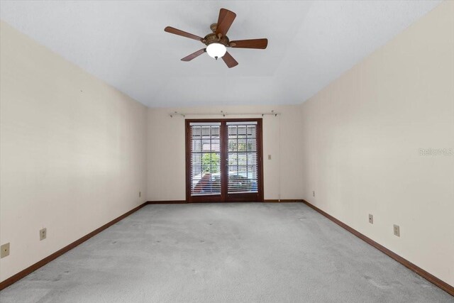 3808 Hollow Wood Dr, Valrico, FL 33594 - empty room with light carpet, ceiling fan, and lofted ceiling