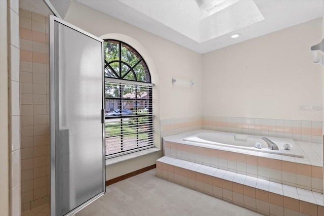 3808 Hollow Wood Dr, Valrico, FL 33594 - full bathroom with a skylight, a bath, tiled shower, and recessed lighting