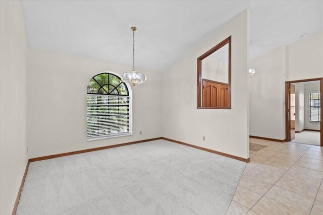 3808 Hollow Wood Dr, Valrico, FL 33594 - empty room with a chandelier, lofted ceiling, and light tile patterned floors