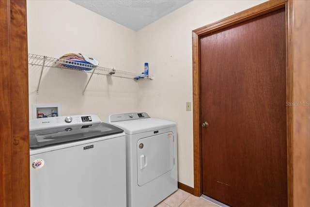 3808 Hollow Wood Dr, Valrico, FL 33594 - laundry room featuring washer and dryer and light tile patterned floors