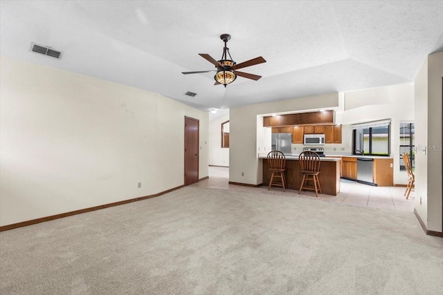 3808 Hollow Wood Dr, Valrico, FL 33594 - unfurnished living room with light carpet and ceiling fan