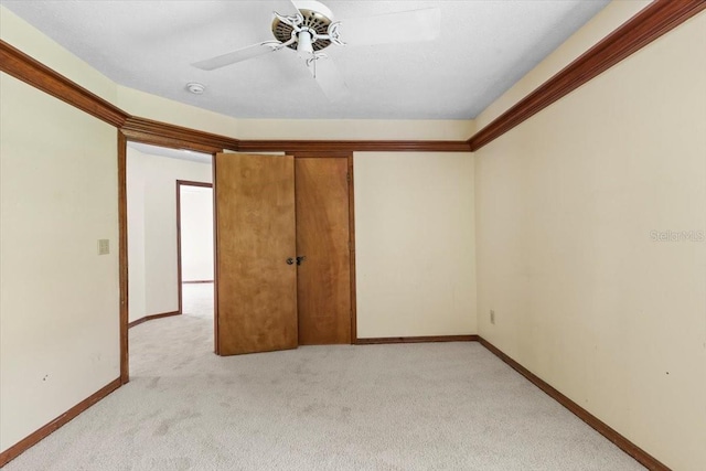 3808 Hollow Wood Dr, Valrico, FL 33594 - unfurnished bedroom featuring light colored carpet and a ceiling fan
