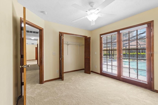 3808 Hollow Wood Dr, Valrico, FL 33594 - unfurnished bedroom featuring light carpet, access to outside, a closet, and ceiling fan