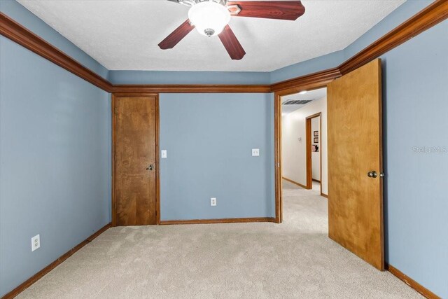 3808 Hollow Wood Dr, Valrico, FL 33594 - carpeted spare room with baseboards and ceiling fan