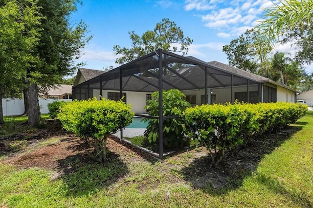 3808 Hollow Wood Dr, Valrico, FL 33594 - rear view of house with an outdoor pool and glass enclosure