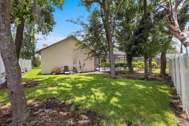 3808 Hollow Wood Dr, Valrico, FL 33594 - fenced backyard featuring a lanai
