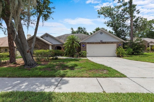 3808 Hollow Wood Dr, Valrico, FL 33594 - single story home with concrete driveway, a garage, and a front yard