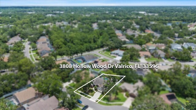 3808 Hollow Wood Dr, Valrico, FL 33594 - aerial perspective of suburban area featuring property parcel outlined