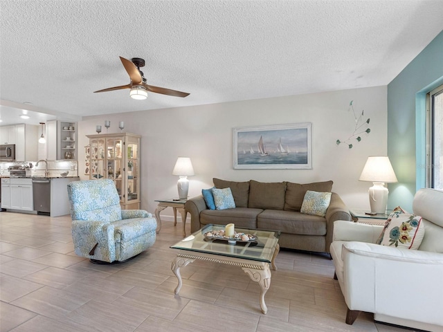 11485 Oakhurst Rd Unit 312, Largo, FL 33774 - living area with a textured ceiling and a ceiling fan