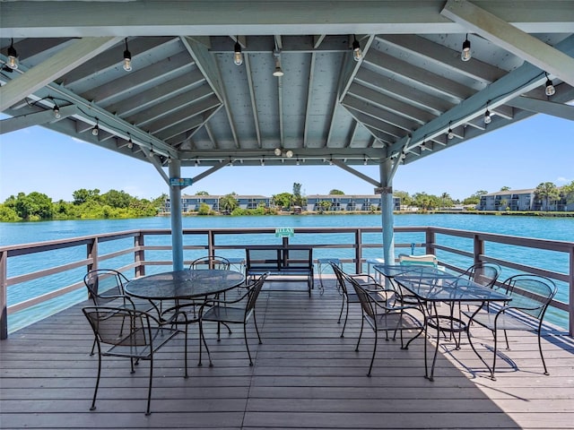 11485 Oakhurst Rd Unit 312, Largo, FL 33774 - dock area with outdoor dining area and a deck with water view