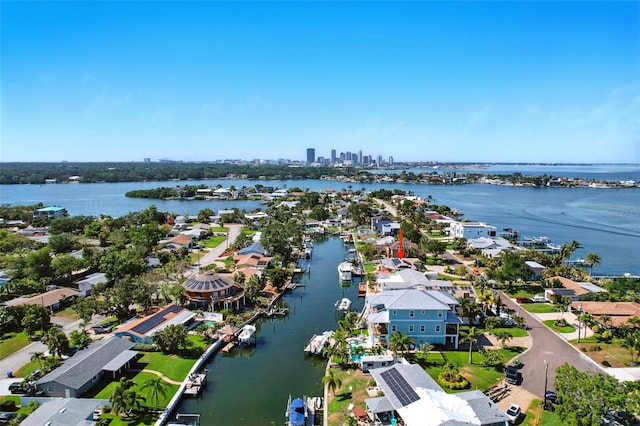 drone / aerial view featuring a residential view and a water view