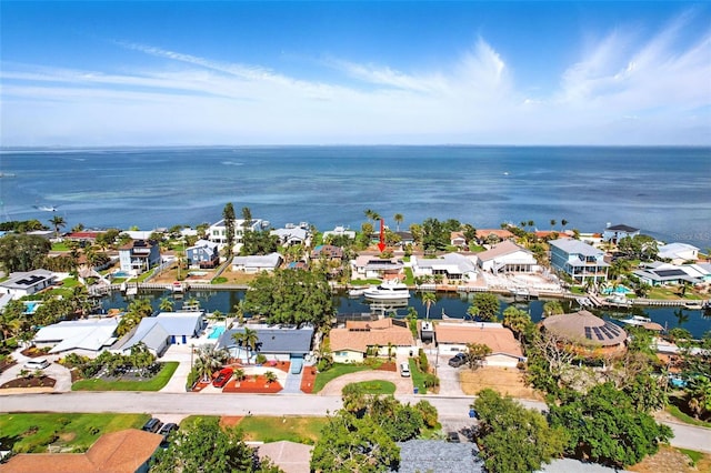 bird's eye view with a water view and a residential view