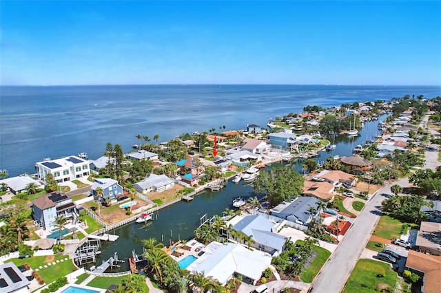 drone / aerial view featuring a water view and a residential view
