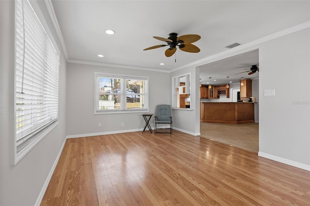 unfurnished living room featuring crown molding, light wood finished floors, a ceiling fan, recessed lighting, and visible vents