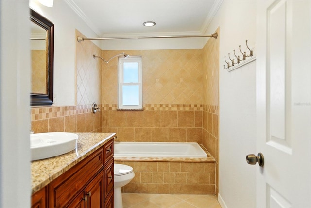 bathroom with tile patterned flooring, ornamental molding, tile walls, and vanity