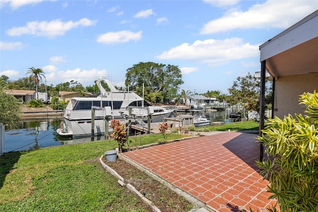 dock area featuring a water view and a yard
