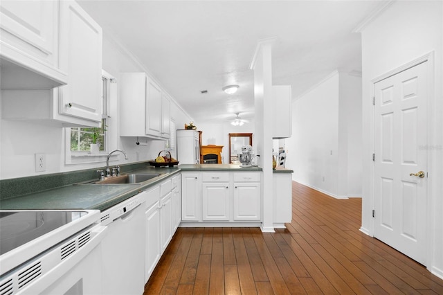 13015 Elm St, Odessa, FL 33556 - kitchen with dark wood finished floors, a sink, white cabinetry, and white appliances
