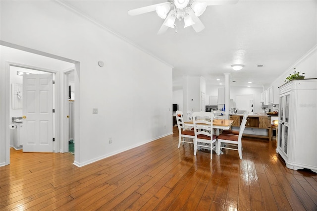 13015 Elm St, Odessa, FL 33556 - dining room with wood-type flooring, a ceiling fan, ornamental molding, and baseboards