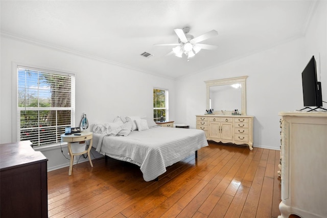 13015 Elm St, Odessa, FL 33556 - bedroom with light wood finished floors, visible vents, ornamental molding, and vaulted ceiling