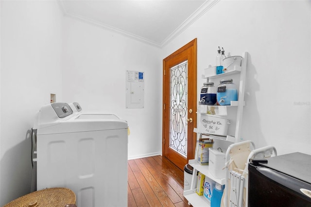 13015 Elm St, Odessa, FL 33556 - washroom with washing machine and dryer, electric panel, laundry area, crown molding, and hardwood / wood-style floors