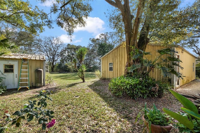 13015 Elm St, Odessa, FL 33556 - view of yard featuring an outdoor structure and a storage shed