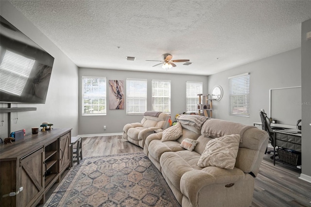 3056 Pointeview Dr, Tampa, FL 33611 - living area featuring baseboards, a ceiling fan, a textured ceiling, and wood finished floors