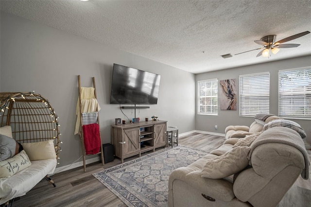 3056 Pointeview Dr, Tampa, FL 33611 - living room featuring baseboards, a ceiling fan, and wood finished floors