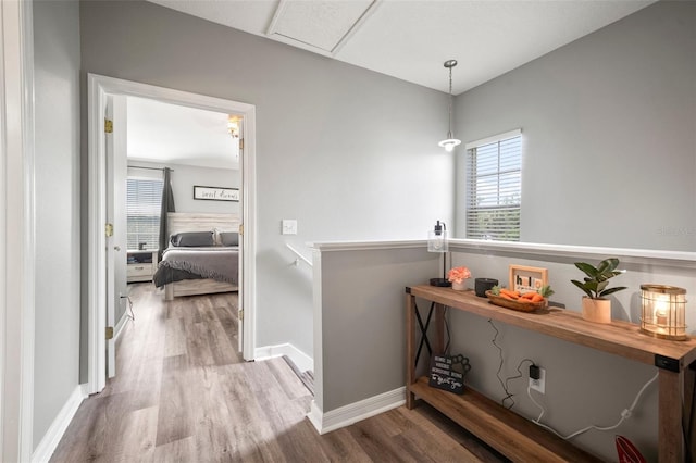 3056 Pointeview Dr, Tampa, FL 33611 - corridor featuring baseboards and wood finished floors