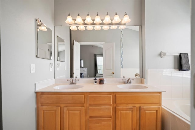 3056 Pointeview Dr, Tampa, FL 33611 - full bathroom featuring a sink, double vanity, and tiled tub
