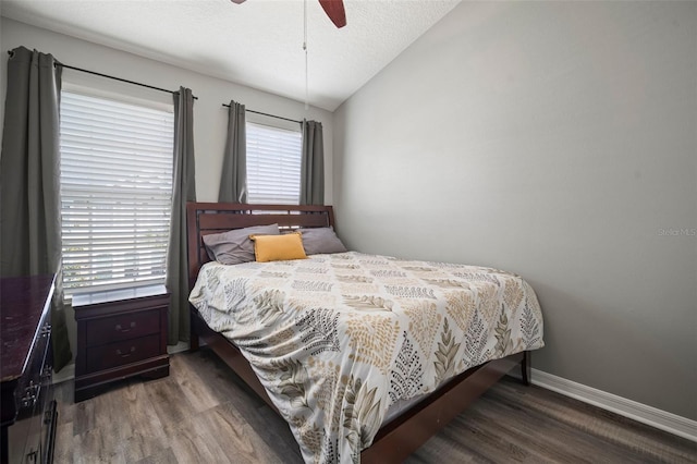 3056 Pointeview Dr, Tampa, FL 33611 - bedroom featuring baseboards, wood finished floors, lofted ceiling, and ceiling fan