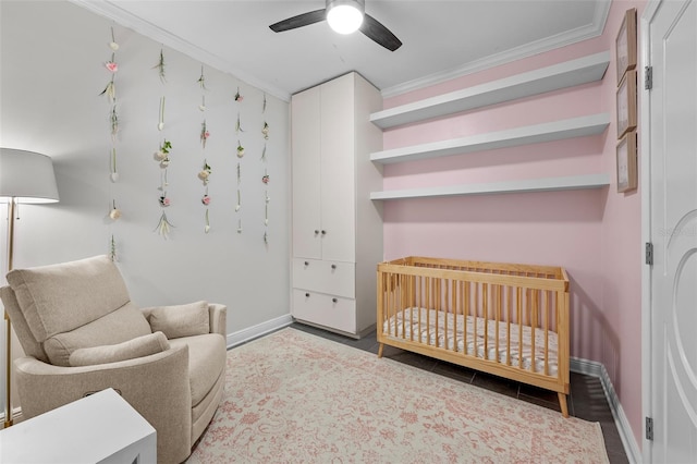 1120 E Kennedy Blvd Unit 1228, Tampa, FL 33602 - bedroom featuring ornamental molding, baseboards, a crib, and a ceiling fan