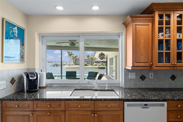 4333 48th Ave S, Saint Petersburg, FL 33711 - kitchen with ceiling fan, brown cabinets, dishwasher, and a sink