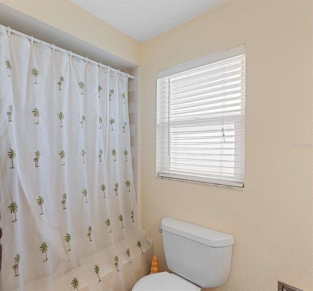 4333 48th Ave S, Saint Petersburg, FL 33711 - full bathroom with shower / bathtub combination with curtain and toilet