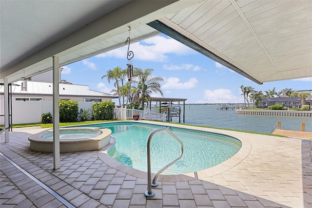 4333 48th Ave S, Saint Petersburg, FL 33711 - view of swimming pool with fence, a water view, a patio, and a pool with connected hot tub