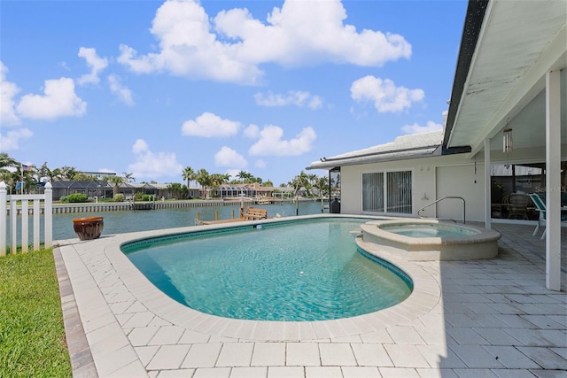 4333 48th Ave S, Saint Petersburg, FL 33711 - view of swimming pool featuring fence, a water view, a patio, and a pool with connected hot tub