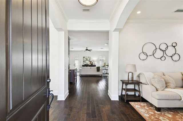 foyer entrance featuring dark wood-type flooring, visible vents, and baseboards