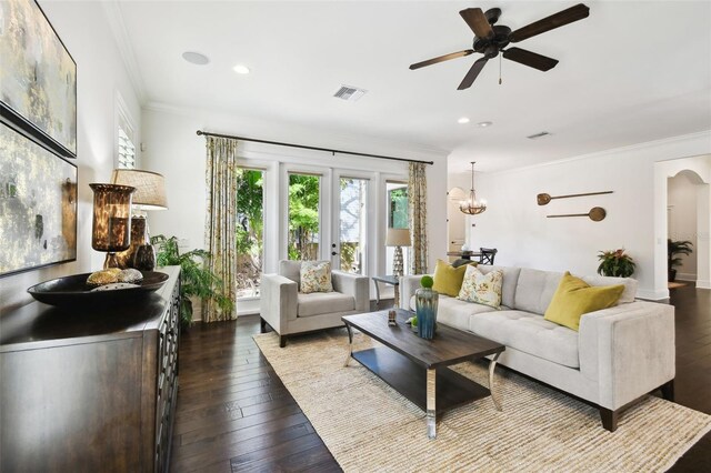 living area with recessed lighting, visible vents, ornamental molding, hardwood / wood-style floors, and ceiling fan with notable chandelier